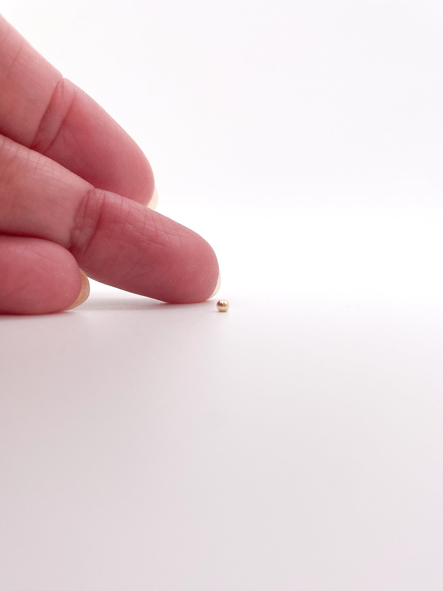 Gold filled kraaltjes 2 mm zakje van 25 stuks